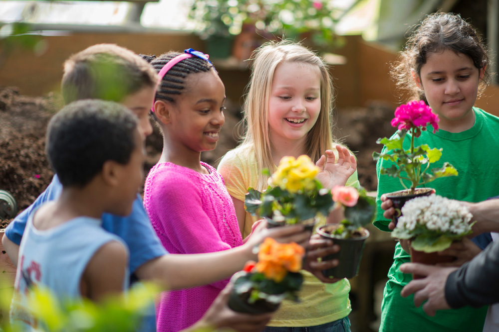 Children learning in greenhouse